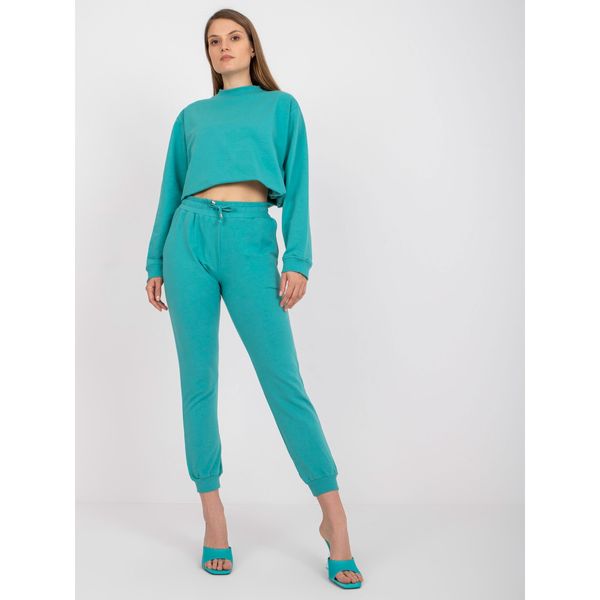 Fashionhunters Basic dusty green sweatpants with a tie detail