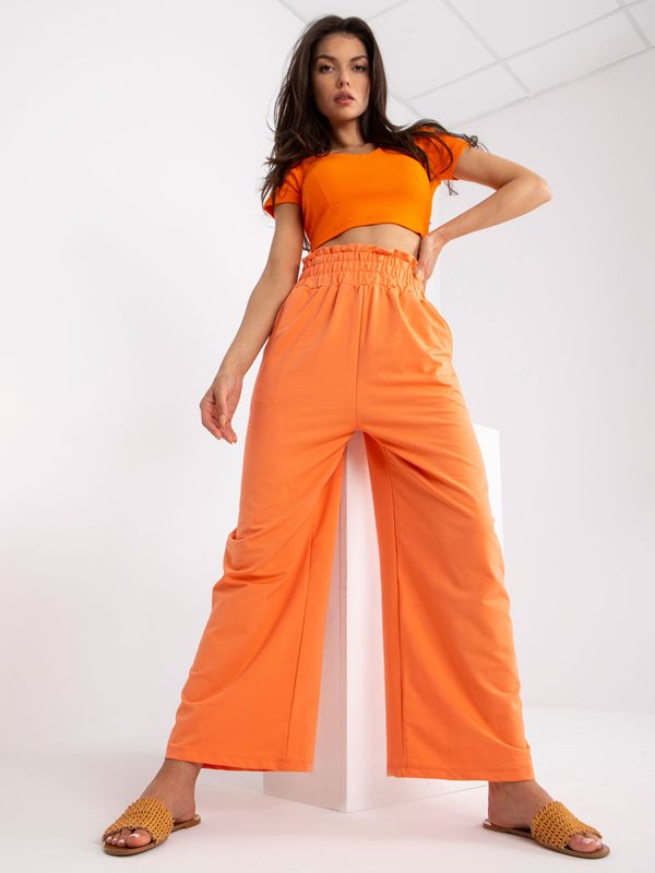 Fashionhunters Basic orange sweatpants with pockets