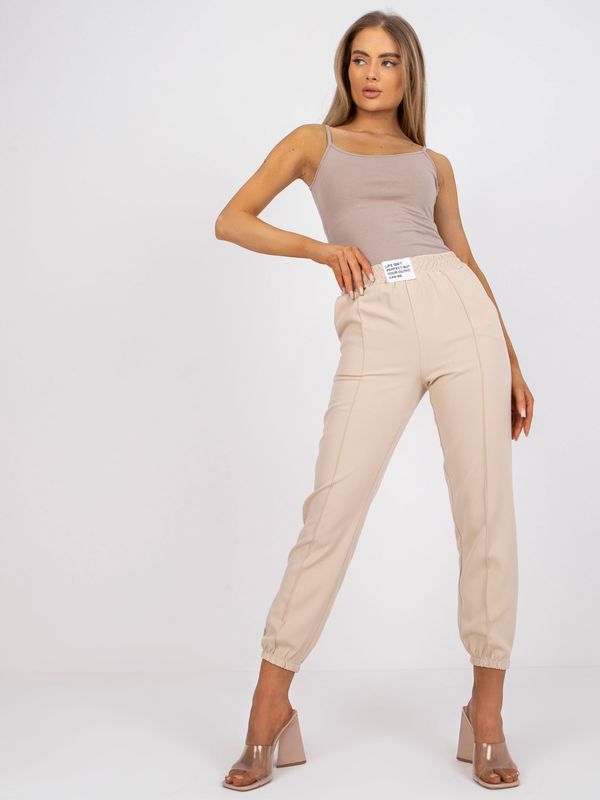 Fashionhunters Beige trousers made of fabric with pockets