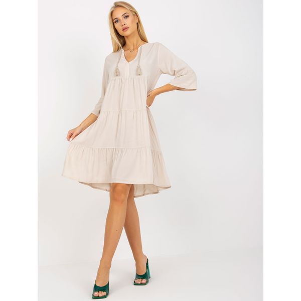 Fashionhunters Light beige oversize dress with a frill and 3/4 sleeves