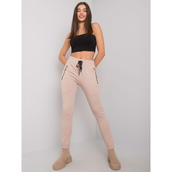 Fashionhunters Light beige women's sweatpants with pockets