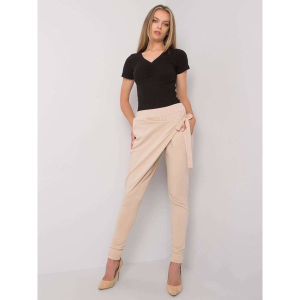 Fashionhunters Light beige women's sweatpants with tying