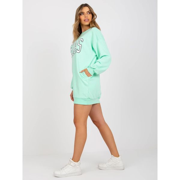 Fashionhunters Light green oversized sweatshirt with a print