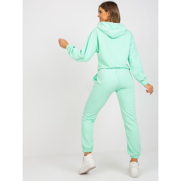 Fashionhunters Light green tracksuit set with a hoodie