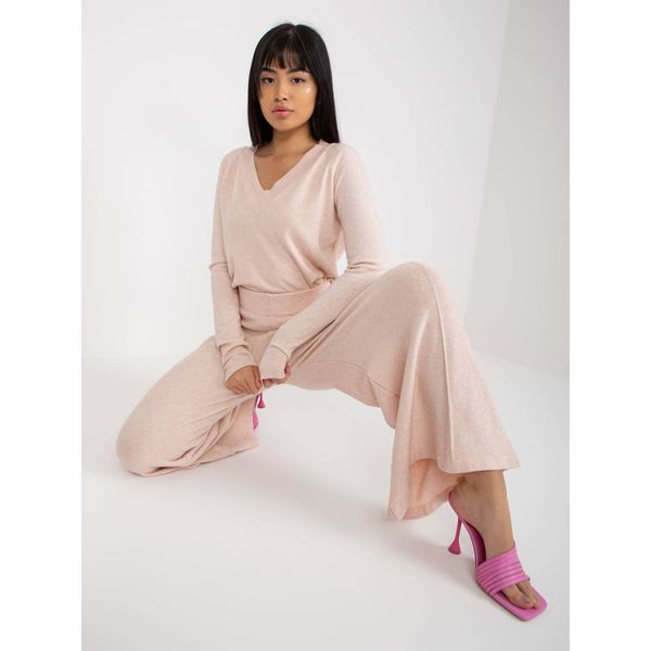 Fashionhunters Light pink knitted trousers with a wide leg
