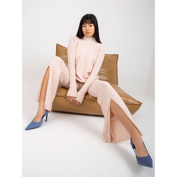 Fashionhunters Light pink wide knitted trousers with a slit