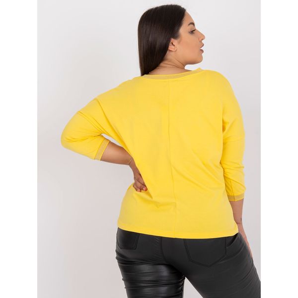 Fashionhunters Plus size yellow cotton blouse with decorative pocket