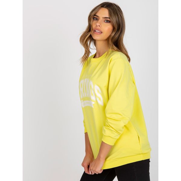 Fashionhunters Yellow and white oversize women's sweatshirt with a slogan