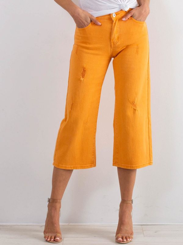 Fashionhunters Zgrane pomarańczowe dżinsy