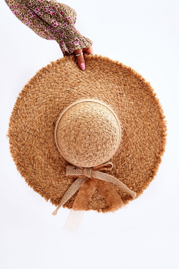 Kesi Lady's straw hat with jute bow beige